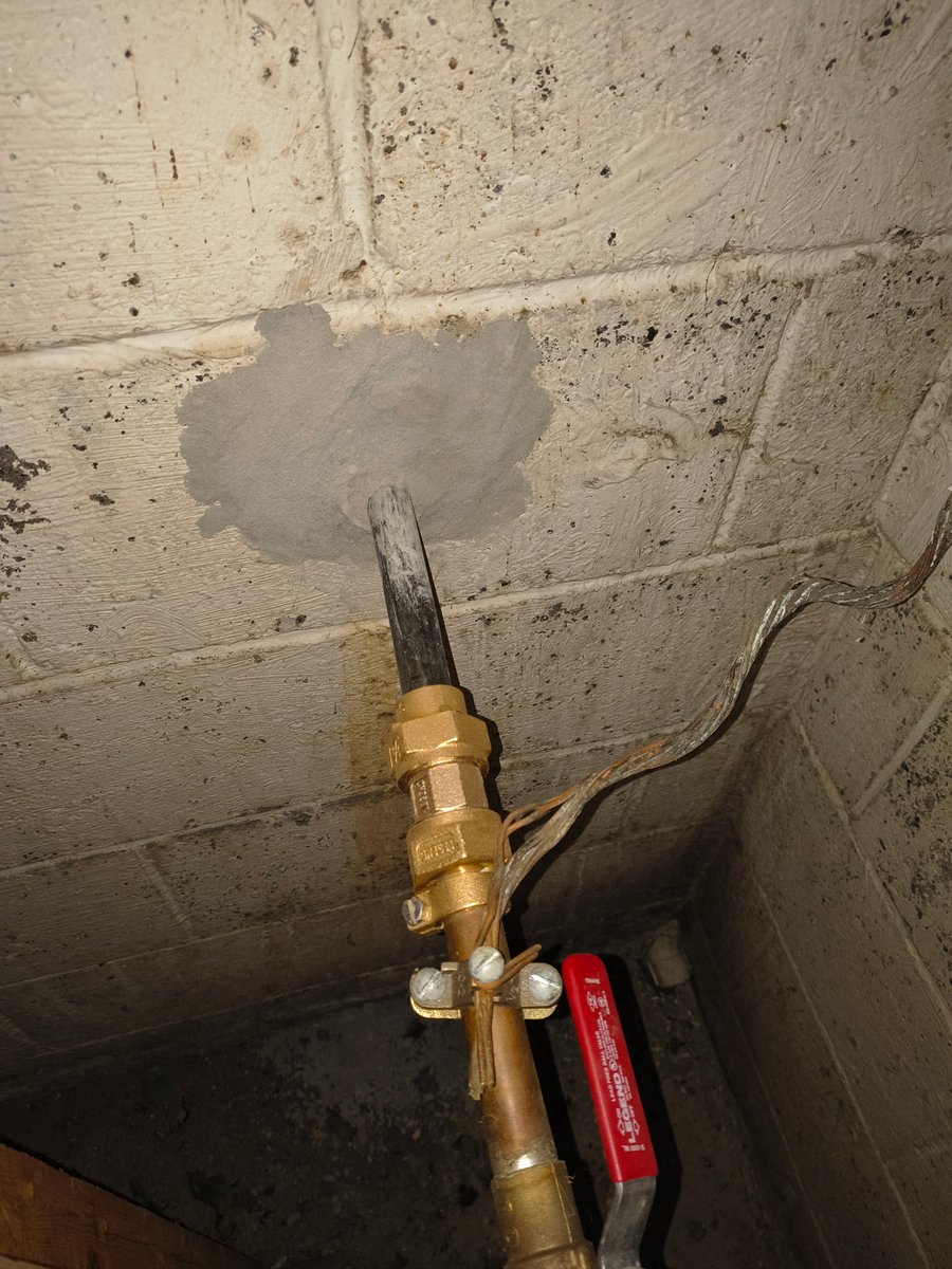 I'm somewhat sympathetic to this mistake but thought it was interesting. Client had their copper water service replaced with PEX after it broke. The stranded wires are the original electric service ground, which probably became ineffective with the pipe upgrade. Moderately