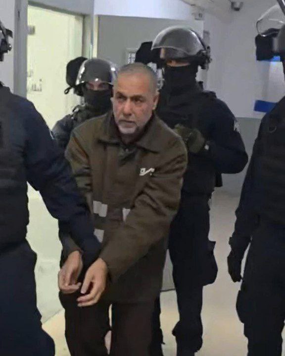 Dr. Hussam Abu Safiya, director of Kamal Adwan Hospital, was subjected to siege, targeting, injury, and threats, and was arrested after refusing to evacuate the hospital and continuing to perform his medical duty despite the killing of his son. He remains in detention amid calls