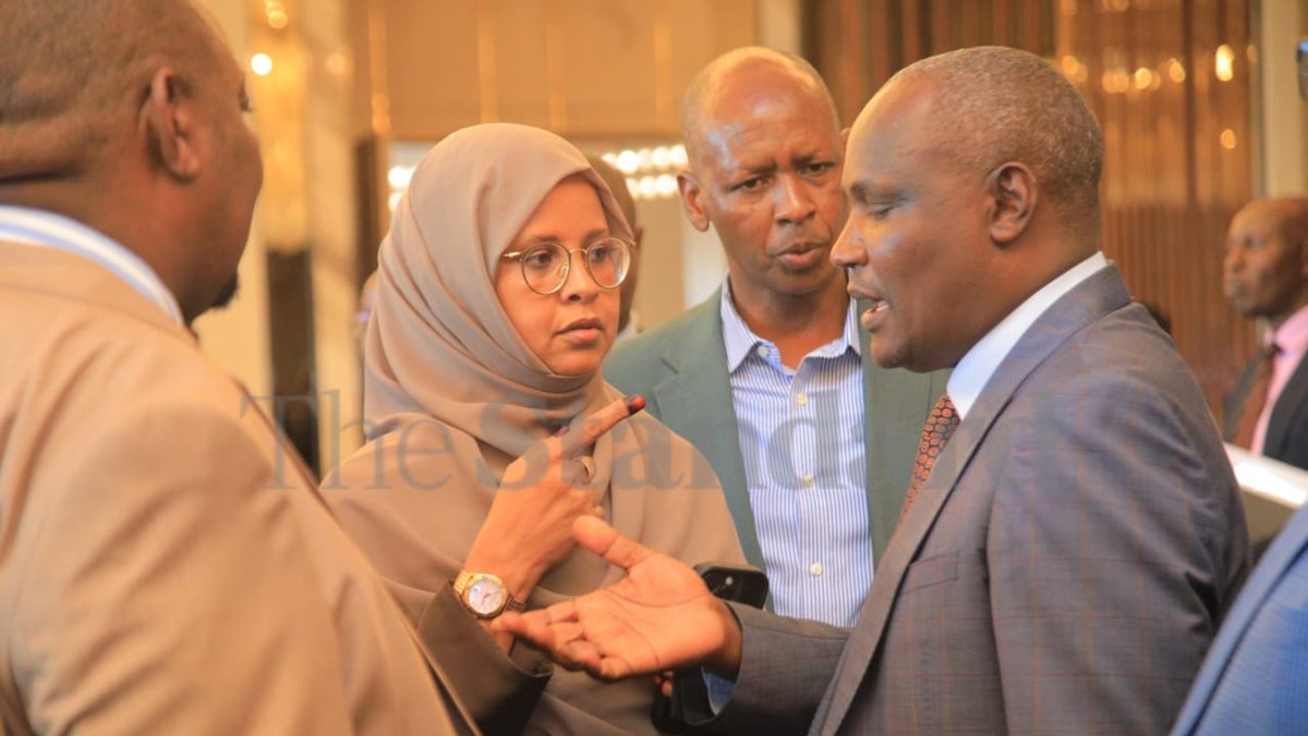 StandardKenya's tweet photo. Treasury Cabinet Secretary John Mbadi and Principal Secretary Dr Chris Kiptoo interact with the co-chairs of the Departmental Committee on Finance and National Planning and the Select Committee on Public Debt and Privatization, Kimani Kuria and Abdi Shurie, and other members after appearing before the committees following his presentation on the partial divestiture of the Government of Kenya’s shareholding in Safaricom PLC, at Glee Hotel, Kiambu Road, on January 13, 2026.

Photos by Elvis Ogina.