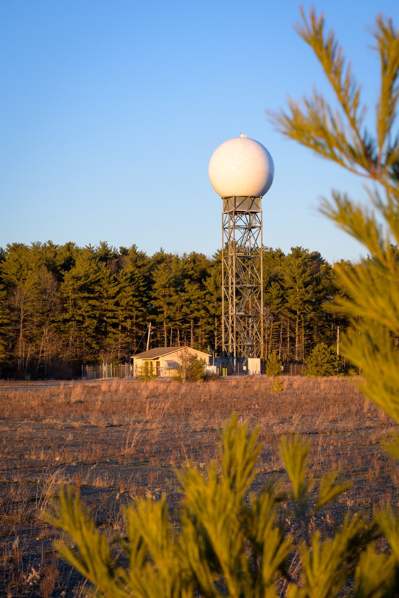 The last warm light catching a weather radar tower at the former naval base in Weymouth.