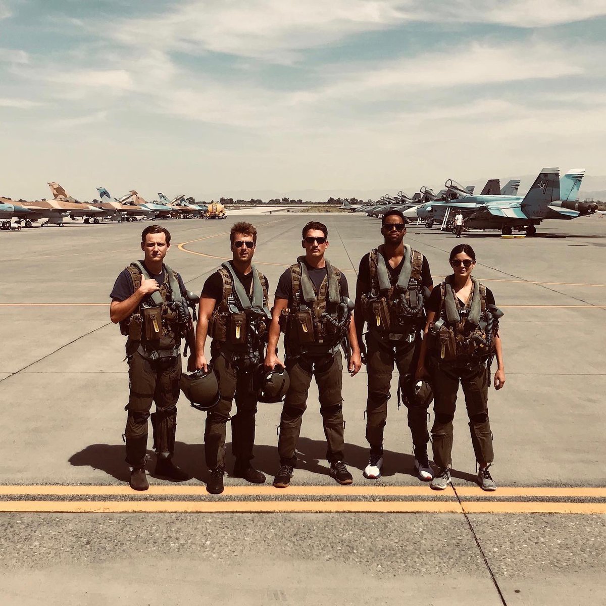 Lewis Pullman, Glen Powell, Miles Teller, Jay Ellis and Monica Barbaro on the set of Top Gun: Maverick
