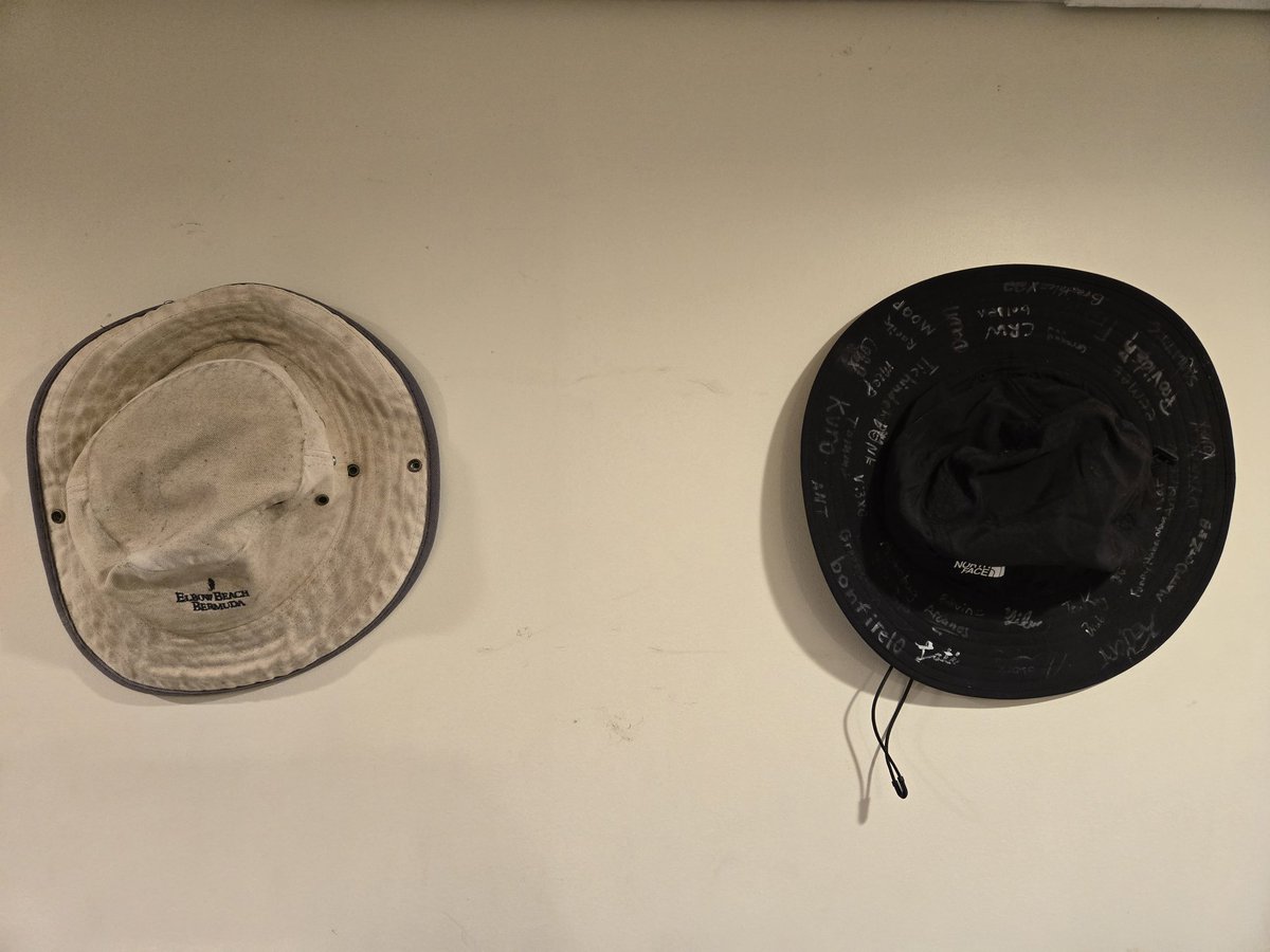 Got these hung up recently.
On the left is my old bucket hat, the first one I used for years in the old days. The hat on the right I got as a present at my birthday tournament back in August, signed by a good few of my friends.
I think I'll be keeping these. :)