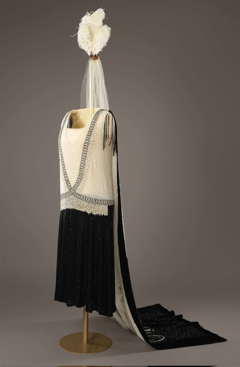 This week's #TwentiesTuesday garment is this Reville Ltd of Paris couture black and white beaded drop-waist dress and matching train, that was worn by Lady Annie Holcroft for her presentation at court in May 1928. <a href="/HRP_palaces/">Historic Royal Palaces</a> Royal Ceremonial Dress Collection. #fashionhistory