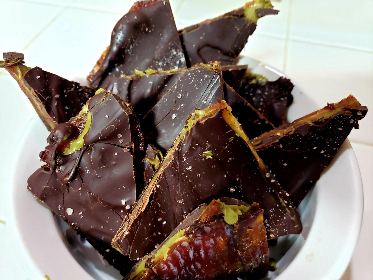 Ruby9Dark's tweet image. Date candy bark really hits my sweet tooth. Pitted and rolled medjool dates til a flat sheet, coated with pistachio butter,  slathered in Scharffen Berger 82% dark chocolate and sprinkled with Himalayan pink salt. Divine.