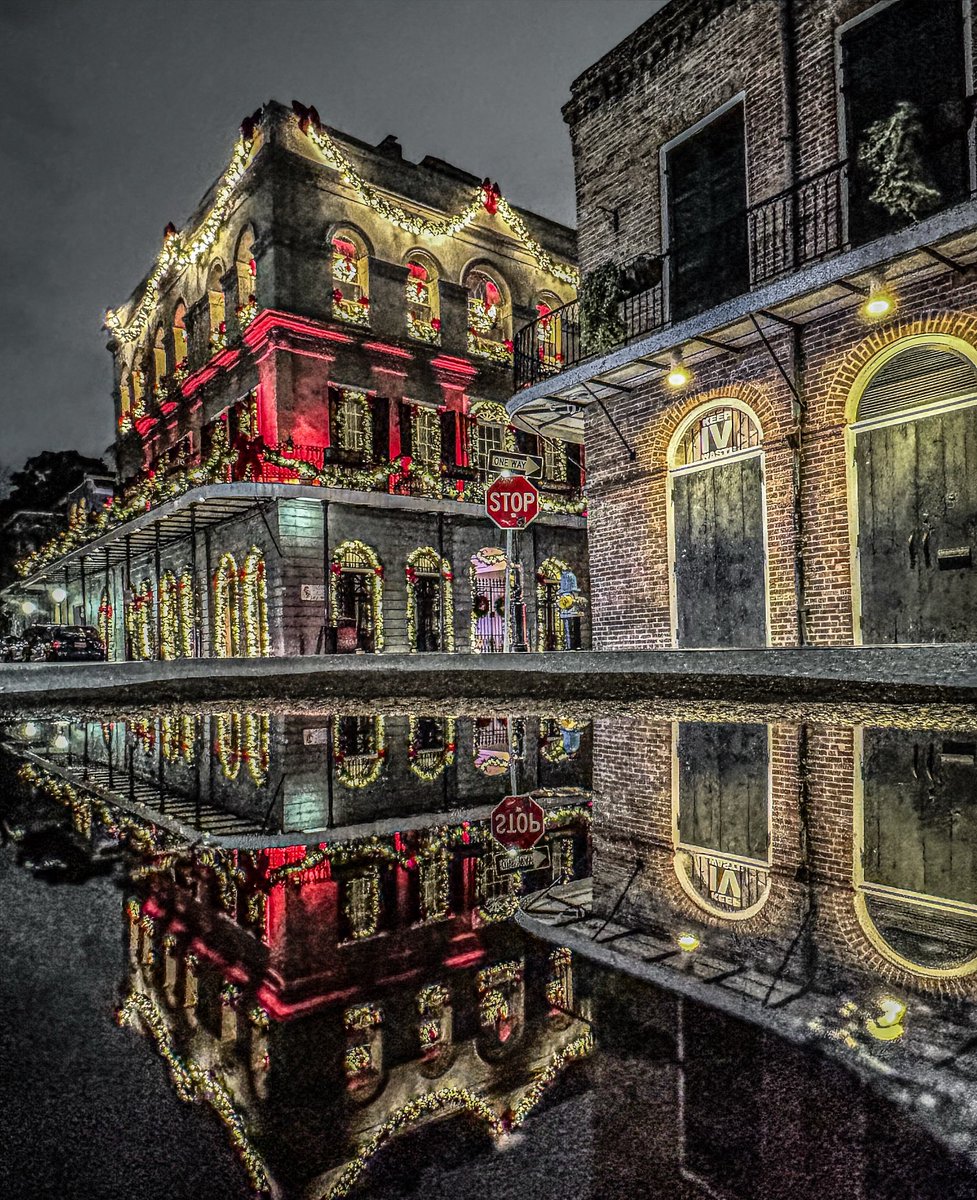 marcorasi1960's tweet image. A puddle on Gov. Nicholls street reflects the LaLaurie mansion, New Orleans