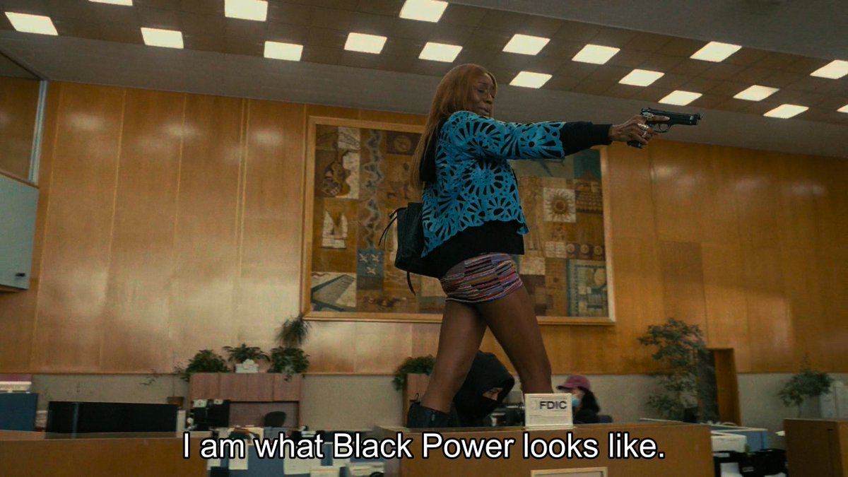 ColdCriti's tweet image. The worst scene was the bank robbery where the "revolutionary" showing her face, threatening civilians, prancing on the tables talk about "I am what black power looks like". This doesnt read like anyone that supports "black power" &amp;amp; more like giftwrapped republican propaganda.