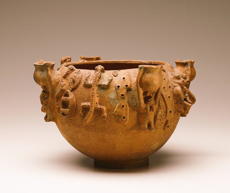Akhe Olokun “Olokun’s Water Vessel”
Akhe Olokun (Olokun water vessel or pot) is a very important object in any altar dedicated to Olokun, the god of the seas and rivers.

In Edo tradition, women are recognised as the primary worshippers of Olokun. After a successful marriage