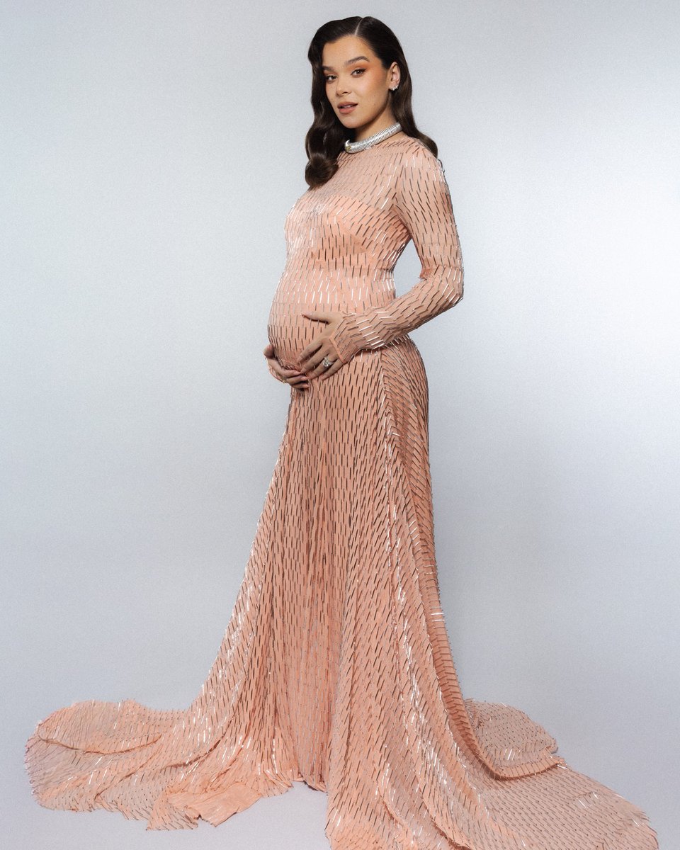 Prada's tweet image. Hailee Steinfeld wore a #Prada peach silk chiffon dress featuring all-over silver sequined crisscross embroidery and silver satin platforms while attending the 83rd Annual Golden Globe Awards on January 11, 2026, in Los Angeles, California.

#PradaPeople #HaileeSteinfeld