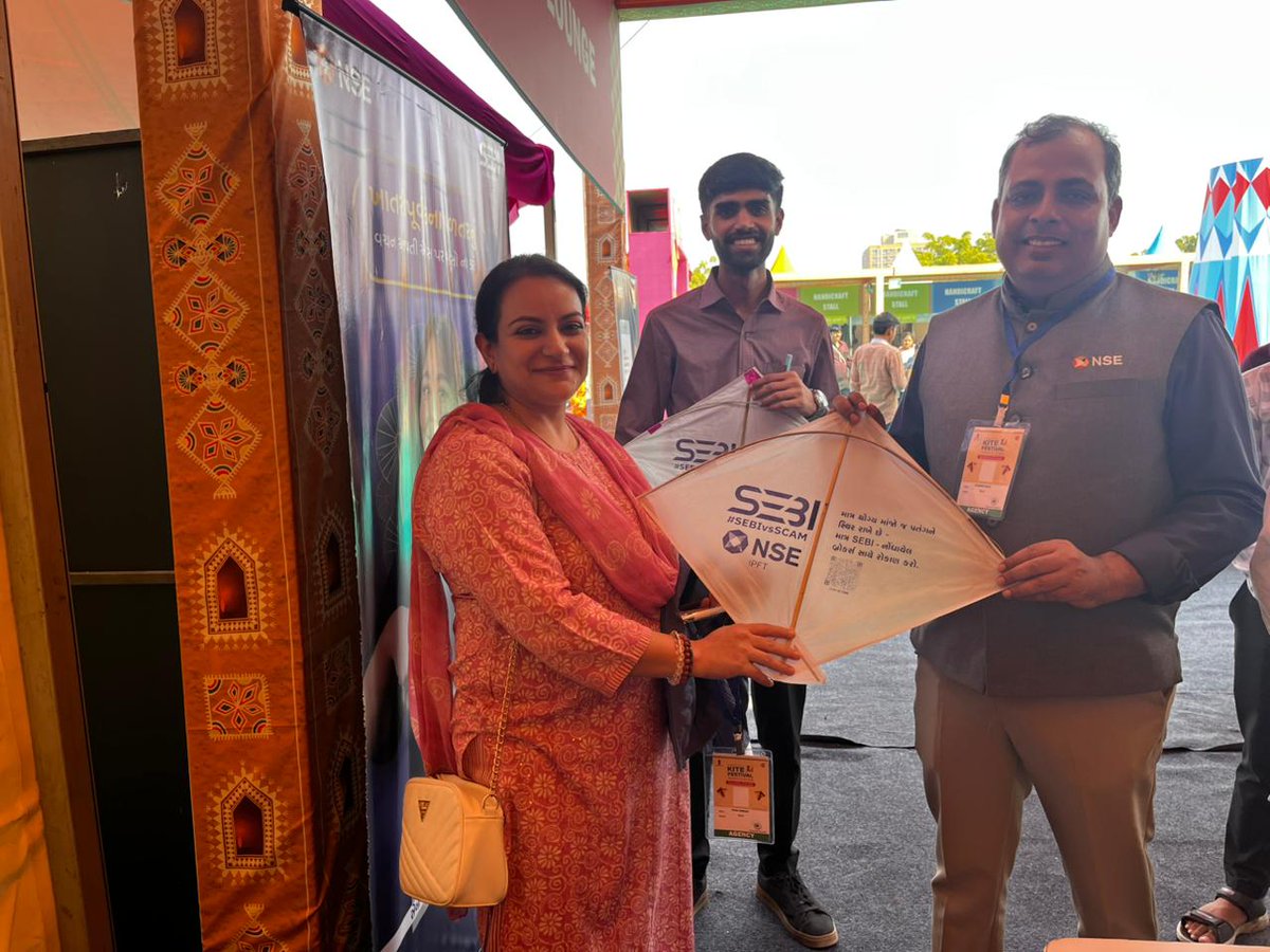 NSEIndia's tweet photo. At the International Kite Festival (IKF) 2026 at Ahmedabad and Jaipur, NSE took investor awareness to new highs. 
Through a dedicated stall, we distributed free kites carrying investor awareness messages—using the spirit of kite flying to spark conversations on smart investing.

The symbolism of kite flying - aspiration, balance, vigilance and foresight align naturally with principals of smart investing and investor protection.
Visitors also received simplified guidance on investor rights, grievance redressal, fraud prevention, and safe investing practices through quick, engaging interactions at the stall.

#NSE #NSEIndia #InvestorAwareness #FinancialLiteracy #IKF2026 #SmartInvesting #InvestorProtection #SafeInvesting #KnowYourRights #FraudPrevention #FinancialWellbeing #MarketEducation @ashishchauhan