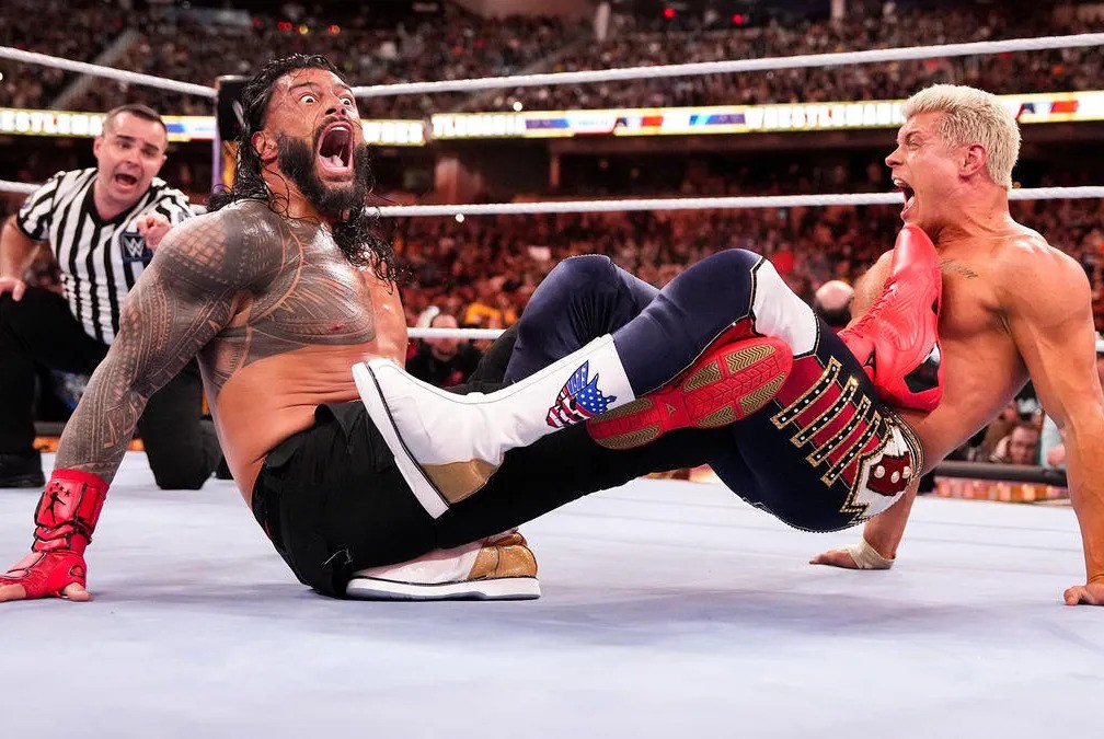 Cultaholic's tweet image. Recent WWE plans for WrestleMania would reportedly see Roman Reigns defeat Drew McIntyre on the road to WrestleMania for the WWE Championship, which would then lead to Cody Rhodes vs Roman Reigns at WrestleMania again. 

"The original direction was literally simply Cody is going…