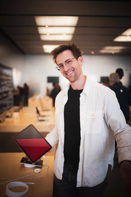 Ryan standing in apple store holding iPad running blackbox tutorial