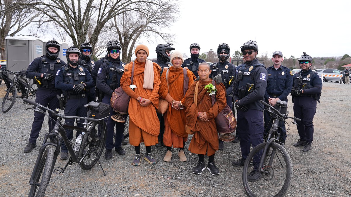 CMPD's tweet image. We were honored to welcome the Buddhist monks today as they pass through our community on their Walk for Peace. Our officers are proud to provide the monks with a safe escort as they continue their journey of compassion and unity.