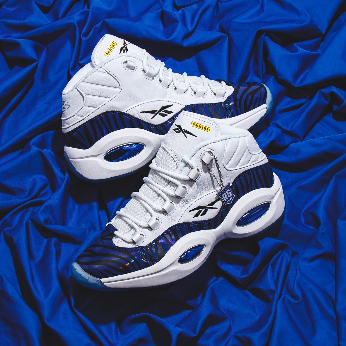 Products's tweet photo. Unleash MVP style with Reebok x Panini Question Mid – iridescent tiger stripes for ultimate flair!