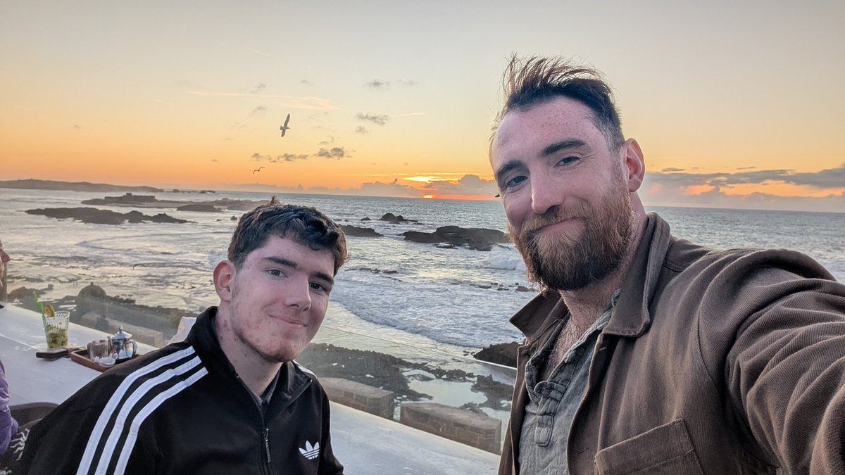 SMSheldrake's tweet image. Here today, gone tomorrow. Me and Michael are spending our last evening sunset-watching and pasta-munching before we watch Morocco v Nigeria in the Fanzone for the AFCON semi-final, then a last couple of beers on the rooftop 🍻 #Essaouira
