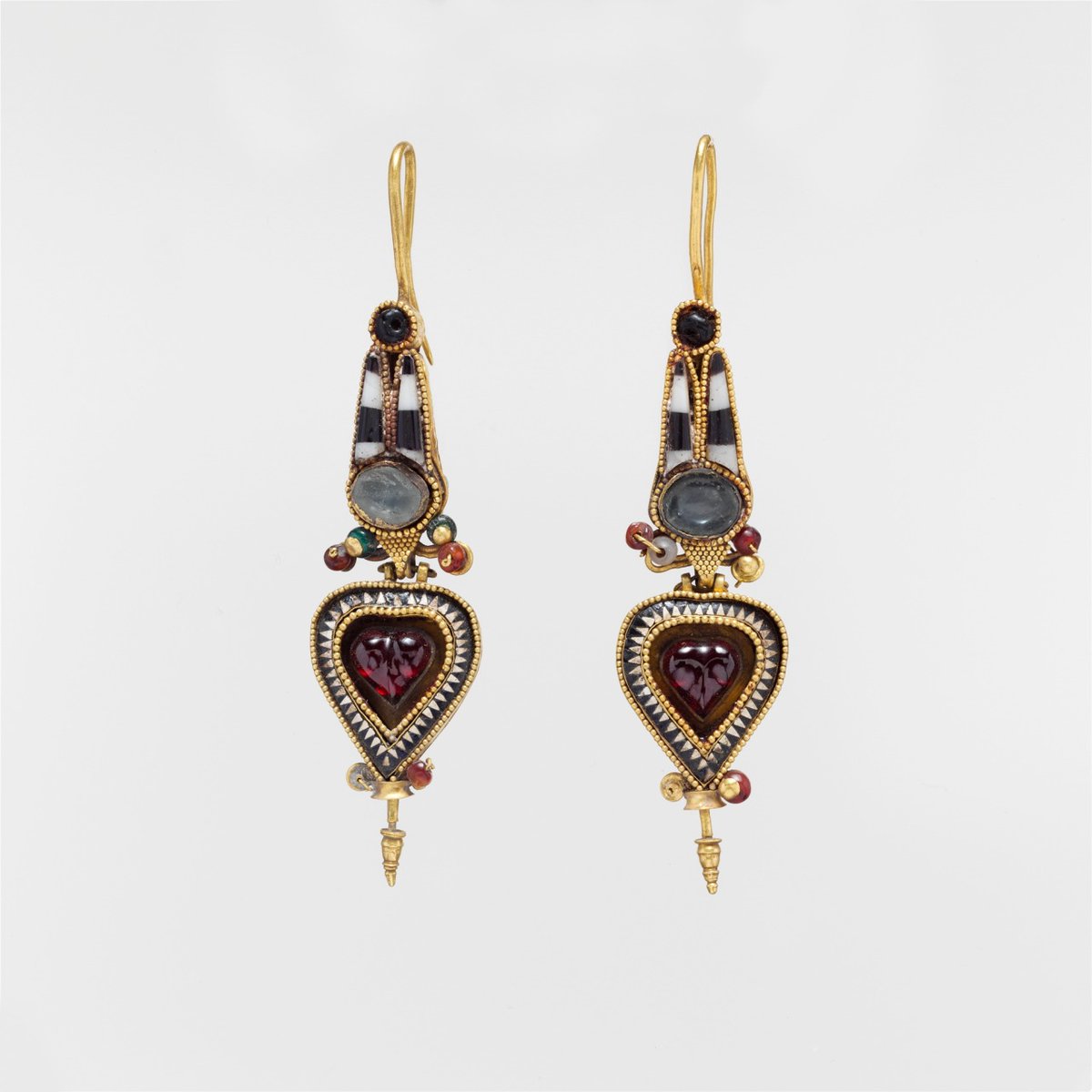 Pair of Hellenistic Greek gold, glass, and stone earrings featuring an Egyptian Atef crown motif, c. 3rd-2nd centuries BC. From the Metropolitan Museum of Art.