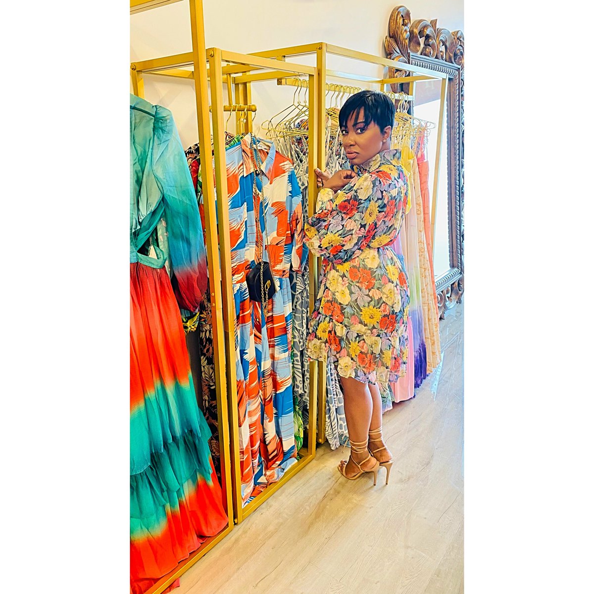 Products's tweet photo. Elevate your style with the vibrant Shannon Floral Dress, perfect for any occasion.