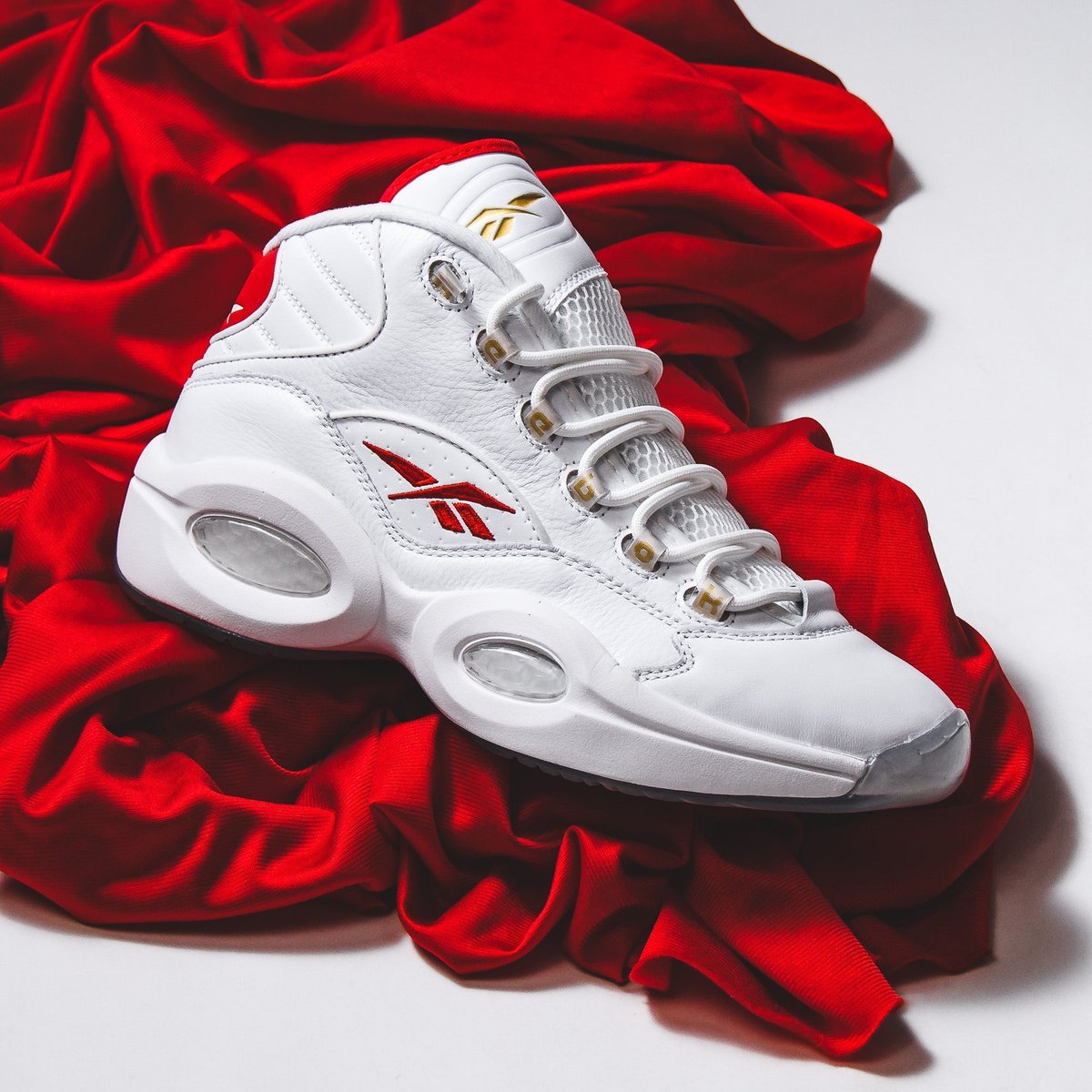 Products's tweet photo. Relive basketball history with Reebok Question Mid sneakers. Iconic style and comfort await!