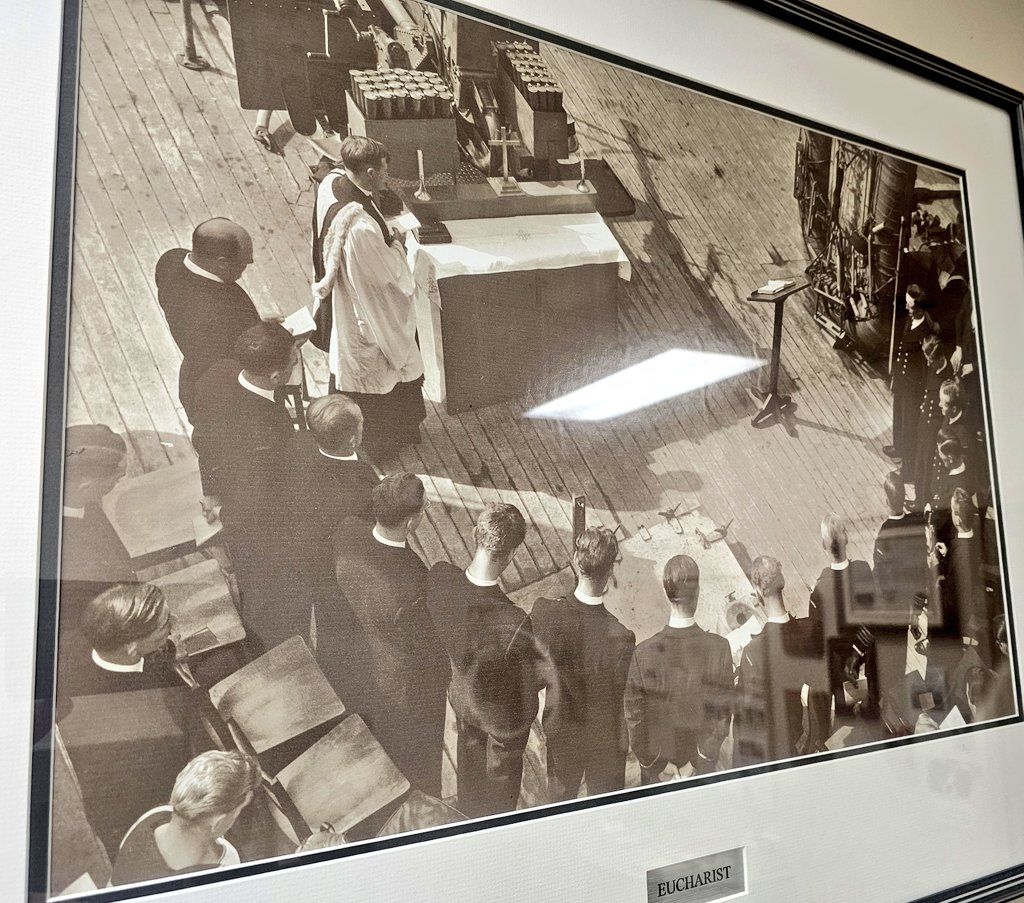 Seen in the fleet chaplain office - An Anglican Royal Canadian Navy Chaplain celebrates North End Holy Communion in the deck of a Ship, with the altar up against a cannon.