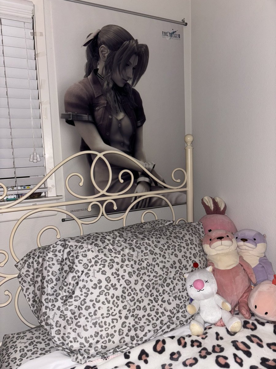 tvcowgirl's tweet image. my aerith poster has gotten sun bleached over the years and she’s turned pink!!💗

then vs now