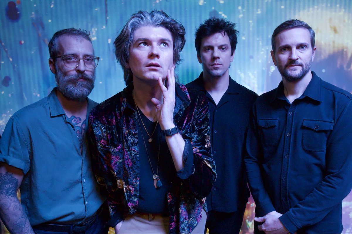 a pic of 4 guys who literally announced a new album today