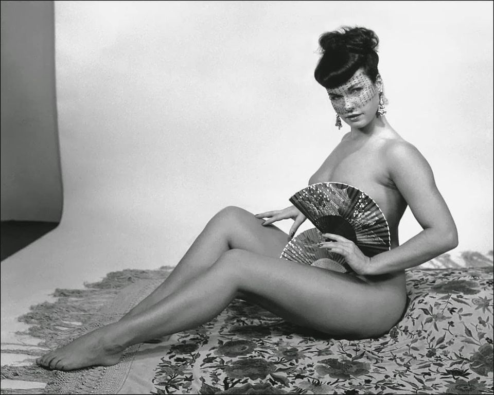 Bettie Page doing her own version of a fan dance.