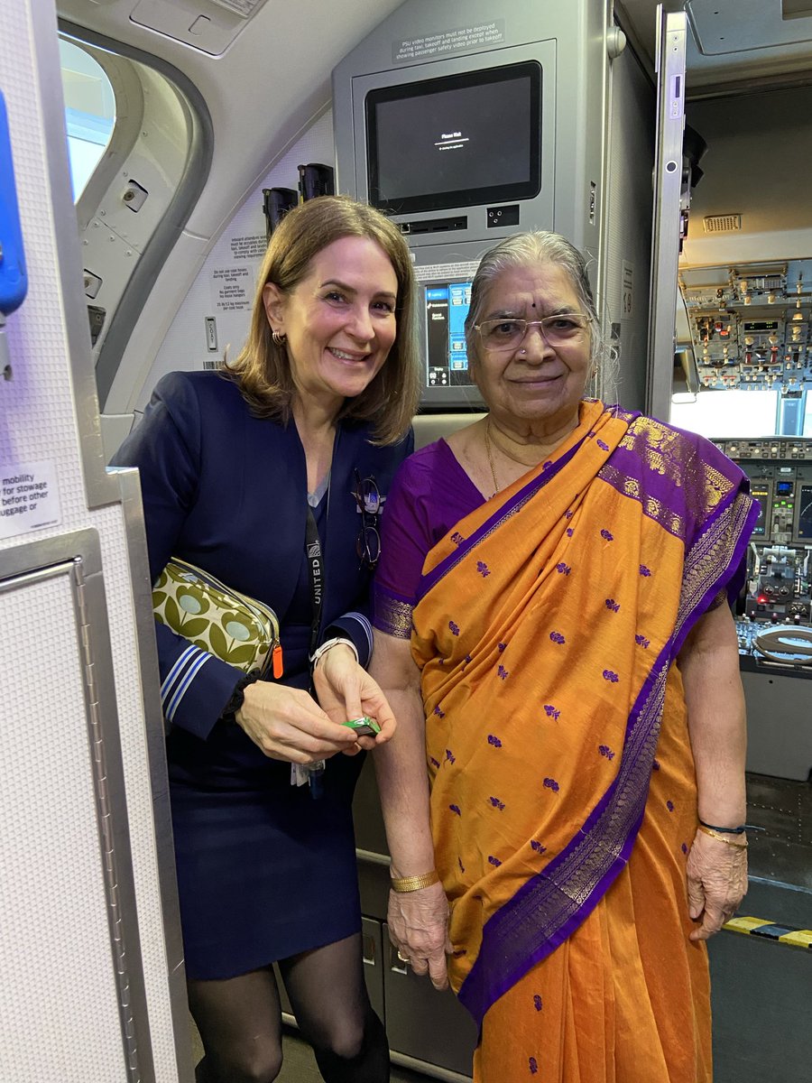 Raghavjuly's tweet photo. The UA’s Flight Attendant was hugely generous for a picture with my mom; my mom was hugely grateful and delighted to pocket double joy as earlier she received the rarest honor of taking a couple of pics with the flight captains! Looking forward to traveling again with UA!!! https://t.co/NcOHzbGMHV