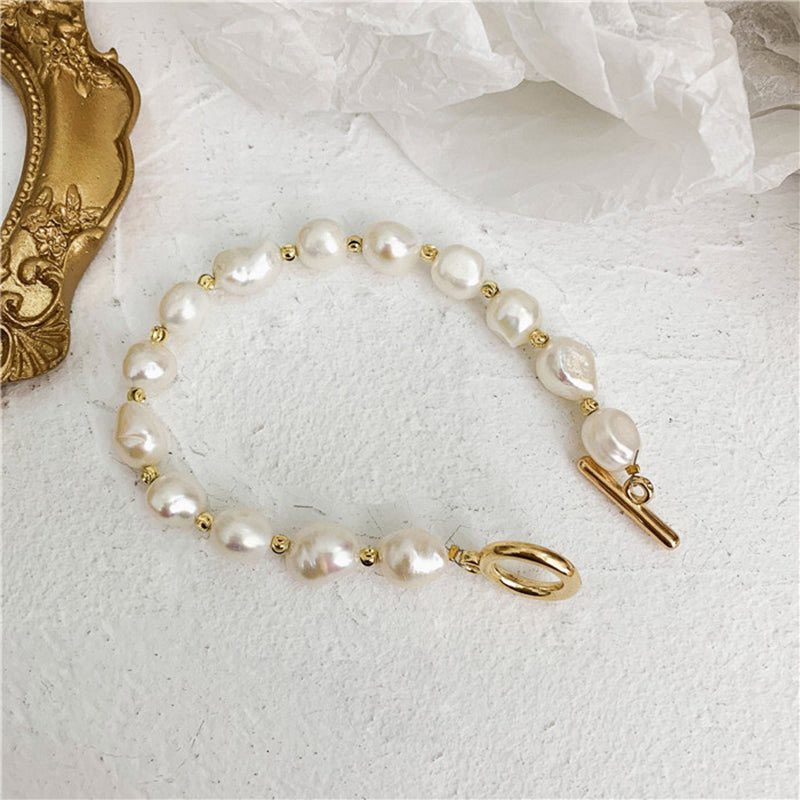 Pearl perfection meets golden glow — elevate every outfit with timeless elegance. Shop our Golden Pearl Bracelet here 👉🏼 simmonsstore.store/products/round… #fyp #explore