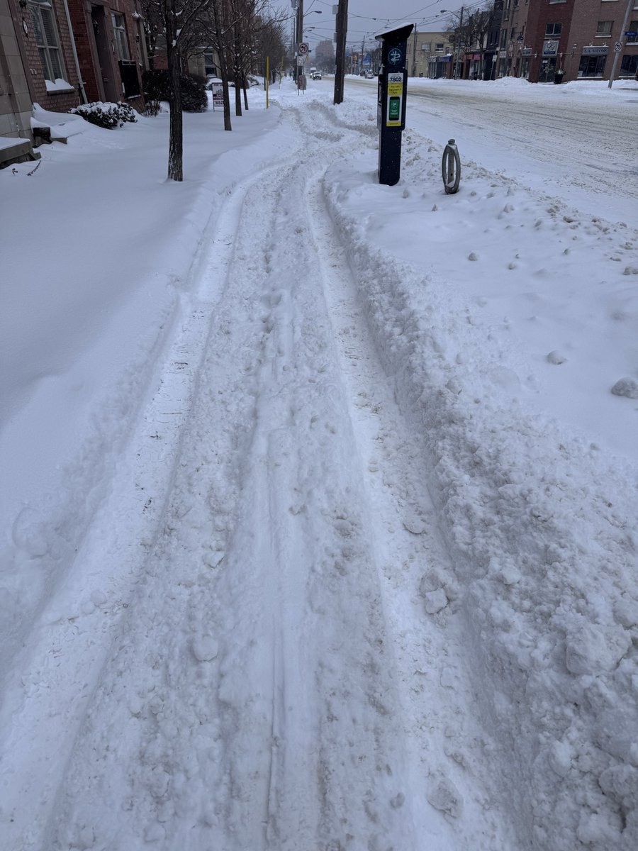 atmarais's tweet photo. @311Toronto I know the sidewalk plows are still working, but this is what the sidewalk on Lakeshore looks like seconds after I saw the sidewalk plow go by. Whoever does south Etobicoke has not improved since the mess of last winter or years before. https://t.co/6TzLCnbZej