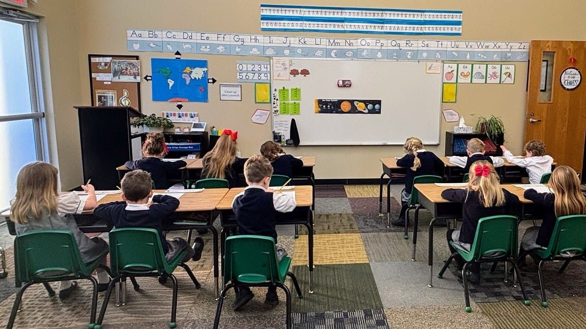 An educator visits a local classical school and is amazed by what students can do: kindergarteners name all continents, first graders write in cursive, kids work calmly without chaos. Classrooms are simple with only useful educational materials. She asks why schools stopped