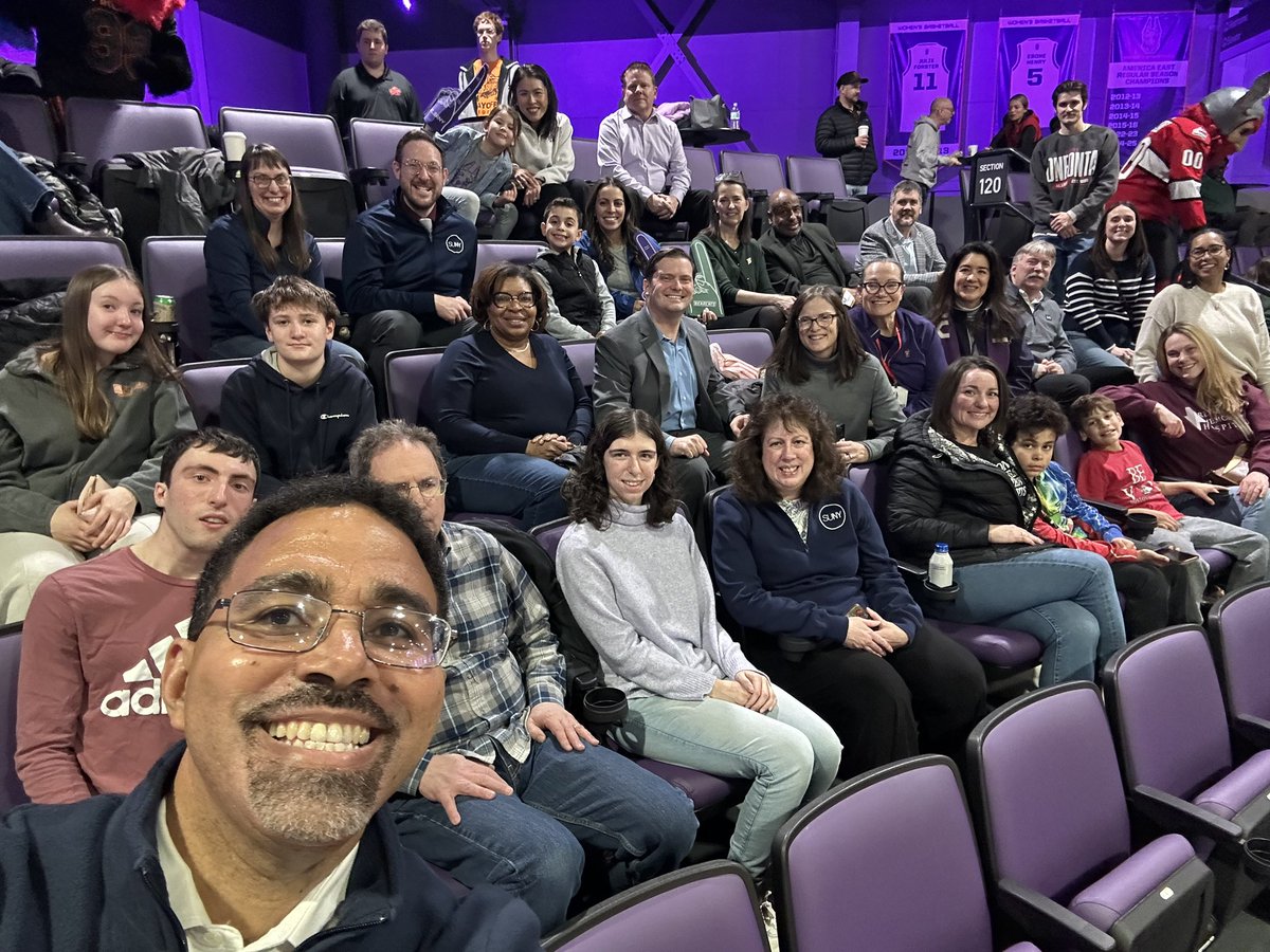 SUNYChancellor's tweet photo. Having a great time at the @ualbany v. @binghamtonu basketball game, including running into President D’Alleva! The crowd is showing their support for our students, and it's always fun to catch a SUNY game. I'm loving all the SUNY spirit on display! https://t.co/hxrtuVuSdv