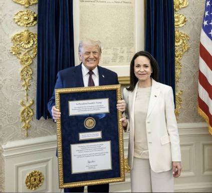 unusual_whales's tweet image. BREAKING: President Trump with the Nobel Peace Prize medal presented to him by Venezuela’s Maria Corina Machado.