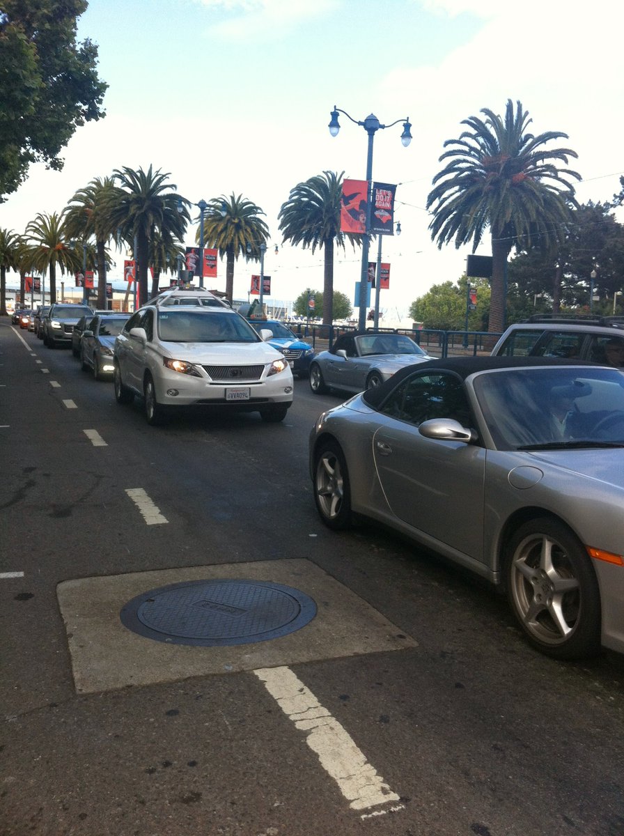 jacindashelly's tweet photo. In 2013, I took this picture of an early Waymo near the Giants' stadium from my bike. 12 years later, just rode from SF to Palo Alto via 101 with me as the only human in the car. Amazing work @Waymo! https://t.co/KmGuScDbI7