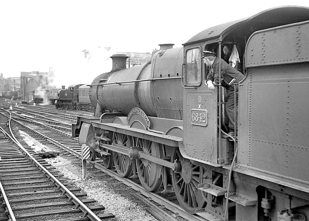 Ex-GWR 4-6-0 68xx class No 6842 'Nunhold Grange', stands at Snow Hill on a down service on 22nd August 1963.