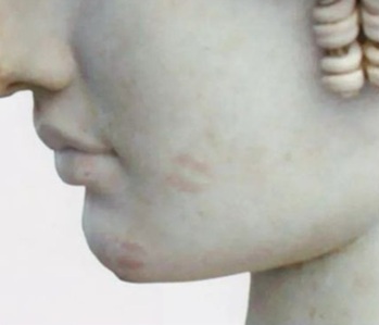Metre-high marble head of Antinous, the teenage Greek male favourite of the Roman Emperor Hadrian. When the head was unpacked on its return from an exhibition tour, it was obvious that someone had given it a couple of kisses (Louvre, 2nd century)