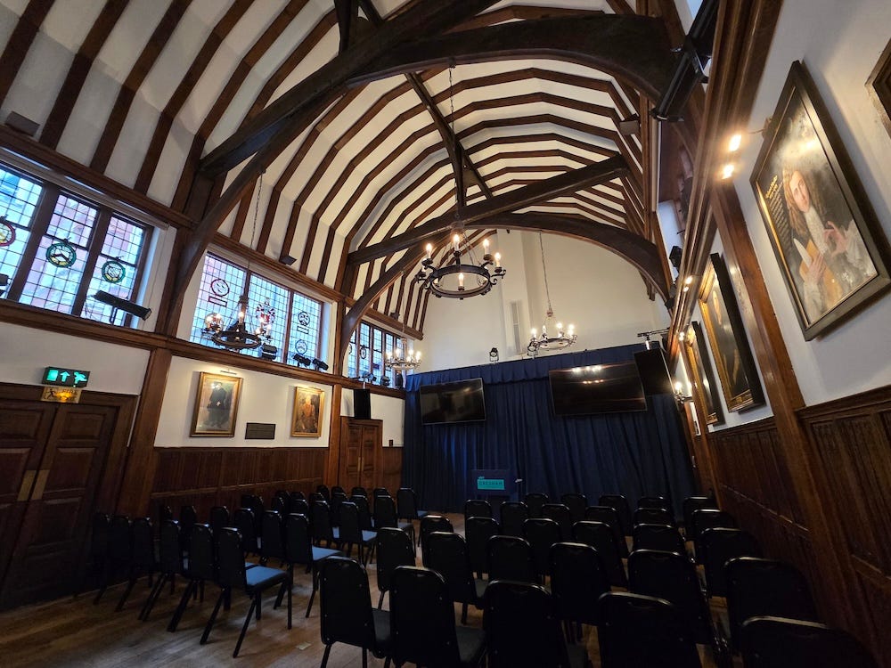 Londonist's tweet image. Hidden behind shopfronts on Holborn is a rare survivor from medieval times, Barnard's Inn Hall. Anyone can visit this incredible building, and below its ancient rafters watch a free Gresham lecture about life, the universe and everything londonist.substack.com/p/inside-holbo…