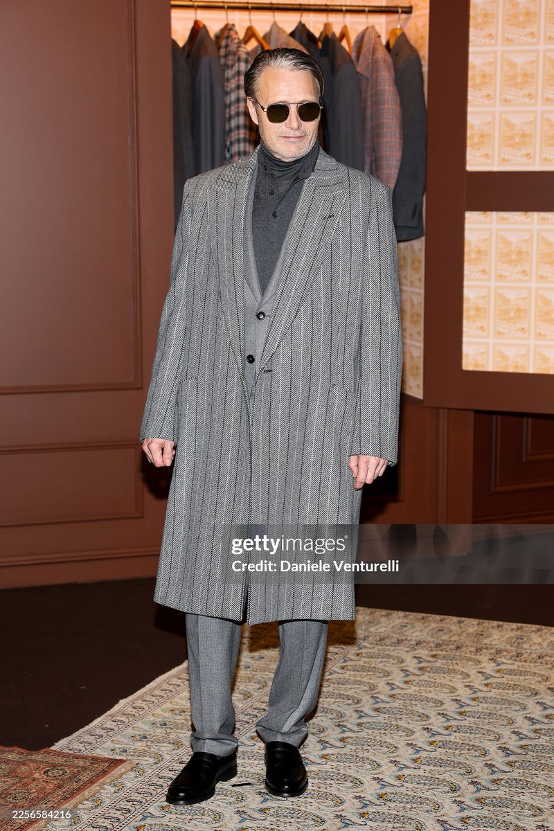 MILAN, ITALY - JANUARY 16: Mads Mikkelsen attends the Zegna fashion show during the Milan Fashion Week - Menswear Fall/Winter 2026-2027 on January 16, 2026 in Milan, Italy. (Photo by Daniele Venturelli/Getty Images)