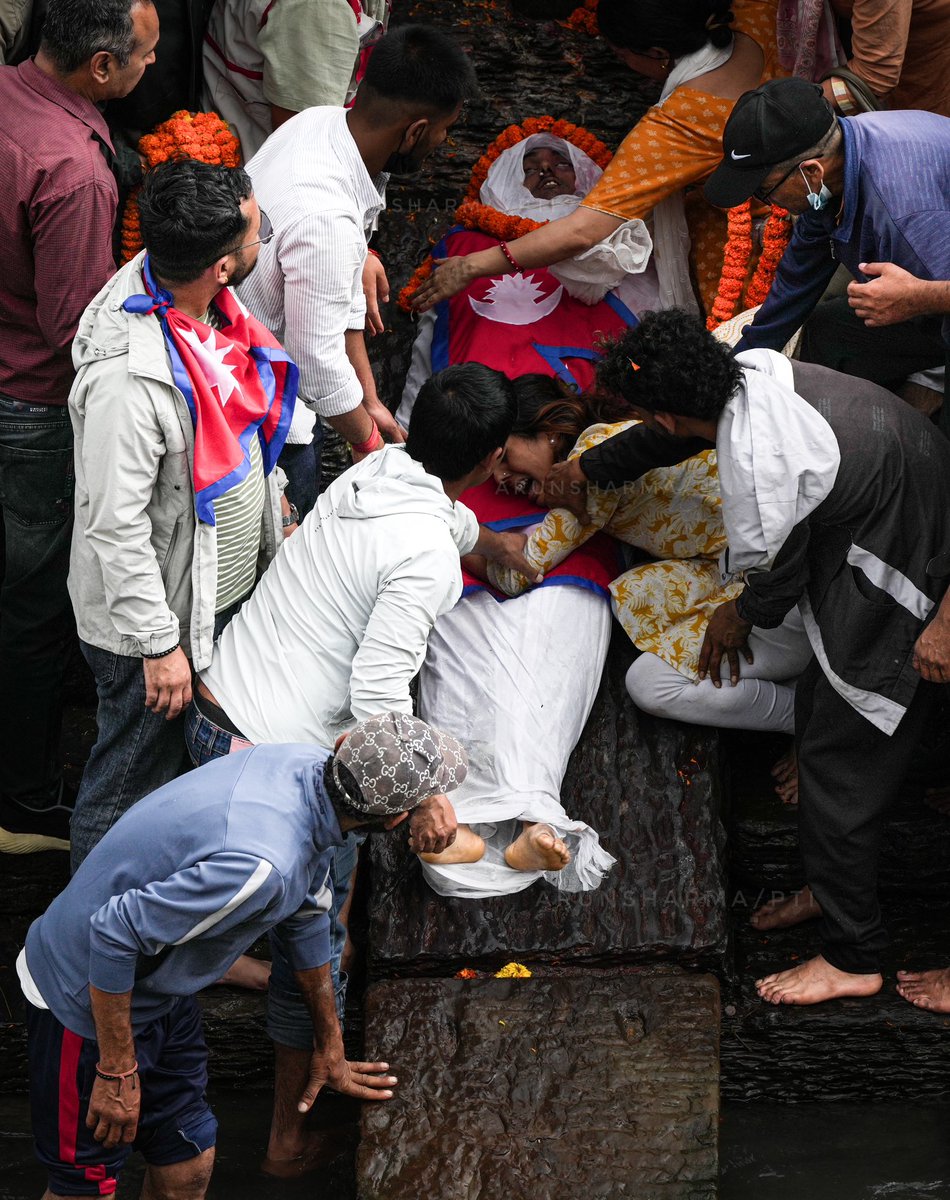 A family member being consoled during the #lastrite  of her kin who was #killed in the recent #anti government #protests, at the premises of #pashupatinath #temple in #kathmandu, #nepal. 

#photojournalistarun #genzprotest  #NepalCrisis #GenZProtestuption #CorruptionFreeNepal