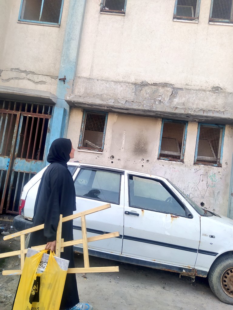 On October 7, I found myself fleeing my home, carrying nothing but a heart weighed down with sorrow. I arrived at a place foreign to my soul a narrow classroom turned into a shelter for human wounds. More than a hundred weary bodies lay beside me, like restless waves searching