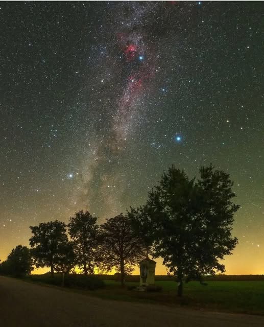 Three bright Stars 

The roadside chapel is a symbol of Podlasie! And above the chapel, the setting summer triangle is formed by three bright stars, Vega, Deneb and Altair. 🌌 

Photo courtesy of Łukasz Żak