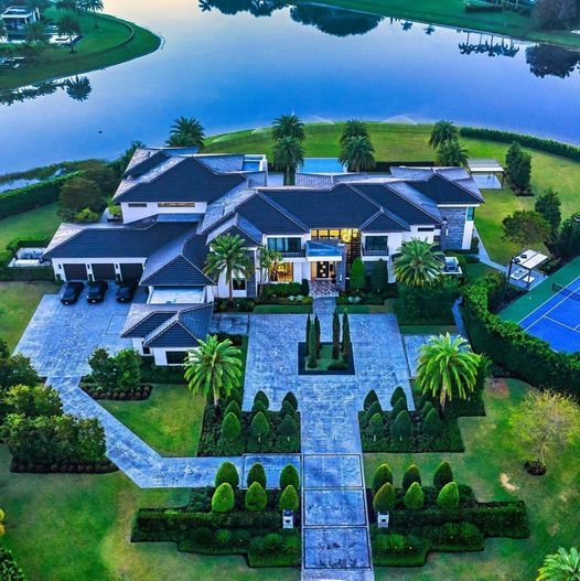 Private and Luxurious Lakefront Mansion with Infinity Pool and Tennis Court in Delray Beach, Florida.