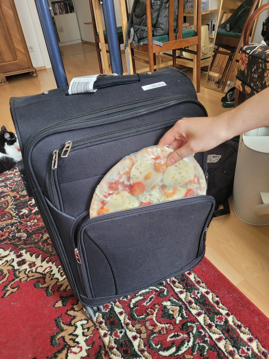 Always remember to put your emergency pizza into the emergency pizza compartment of your suitcase before you leave for  a journey!