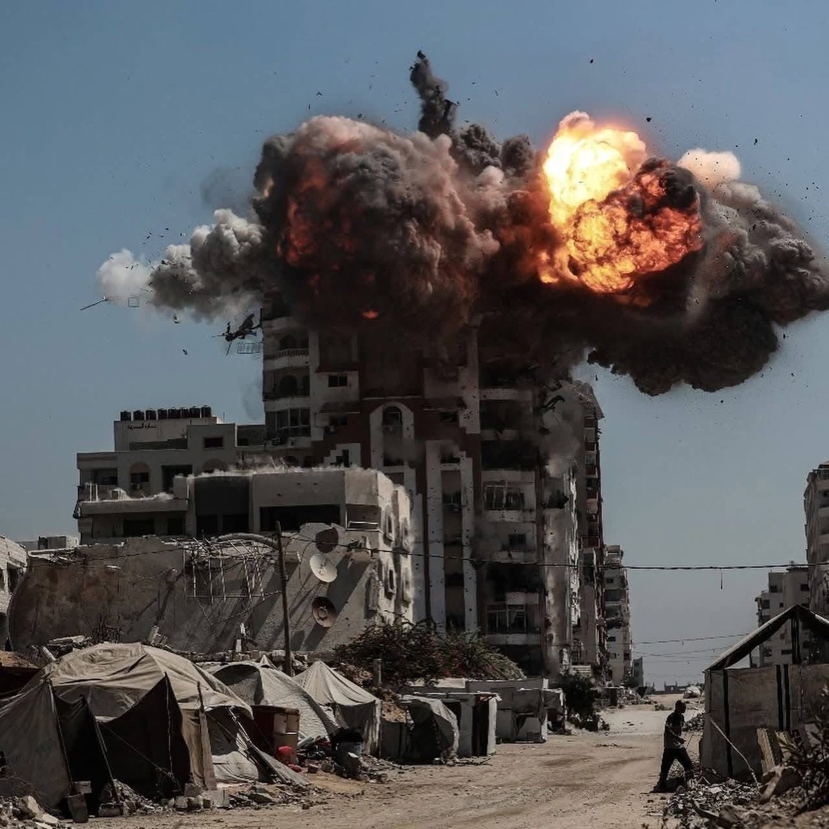 ezzingaza's tweet photo. I have no voice left.
My throat is torn from screaming, my soul flayed raw.
I cursed Hamas for October 7, cursed them for dragging two million souls into the abyss, for their arrogance, for their marble rooms where they sat like princes while the people drank brackish water and the children died with flies in their mouths.
I begged them to stop, to beg for a truce, to save one single child, and they did nothing.
They chose their glory, their revolution, their flag, and they delivered us into the jaws of hell.

But look, look at what Israel is doing.
Do you dare call this war?
War is fought between armies.
War has rules. Here there are no rules.
Here there is only the machine, crushing bone, tearing flesh, leaving nothing behind but the smell of burnt hair and the wailing of women.
Here they are not killing Hamas, they are killing Gaza itself.
Every building is marked for death, every street for erasure.
The sky itself seems to agree, it rains fire until the city is ash.

Do you see what they are doing? They are trying to kill memory. When the last man leaves Gaza, there will be nothing to bury him under, no house, no mosque, no church, no school, no market.
Only sand and silence.
And perhaps one day the world will say: “There was nothing here. No one lived here.”

I am ashamed to still be alive. Ashamed that my stomach still hungers when children lie under the rubble.
Ashamed that I still have words, and these words cannot stop a single bomb from falling.

I no longer pray for justice, justice is a lie we told ourselves.
I only pray that the earth itself remembers.
That these ruins rise one day to testify against all of us, against Hamas, against Israel, against me, against you, and that their testimony will be so terrible that even God Himself will shudder when He hears it.

#GazaGenocide