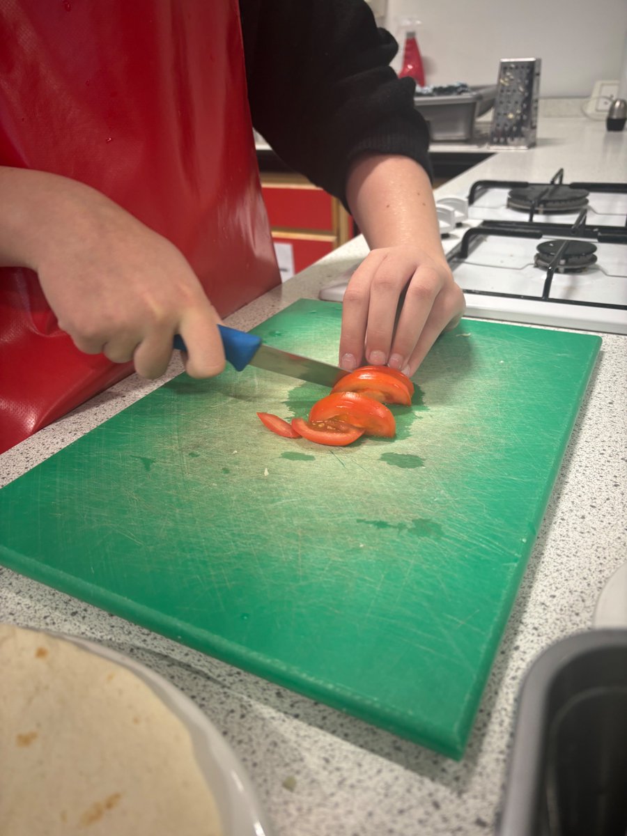 StBensHFT's tweet photo. S1 pupils practising their ‘claw’ and ‘bridge’ positions in HFT. Excellent knife safety shown by our young people of @stbenedictsren https://t.co/c1ryAbOCio