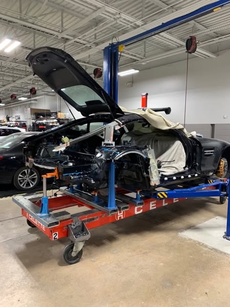 The 2018 Mercedes-AMG GT, which has heavy damage to the rear, is now set up on a Celette Sevenne frame machine using dedicated jigs designed specifically for this model to ensure the car is repaired back to original factory standards.
