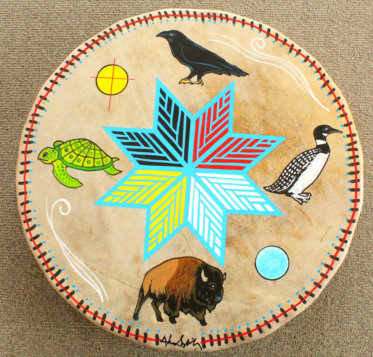 The Daily Drum
The spirits of the raven, the loon, the buffalo and the turtle surround the eight-pointed star. Also representations of the sun, the moon and wind are surrounding the star.
Have a Great Day!