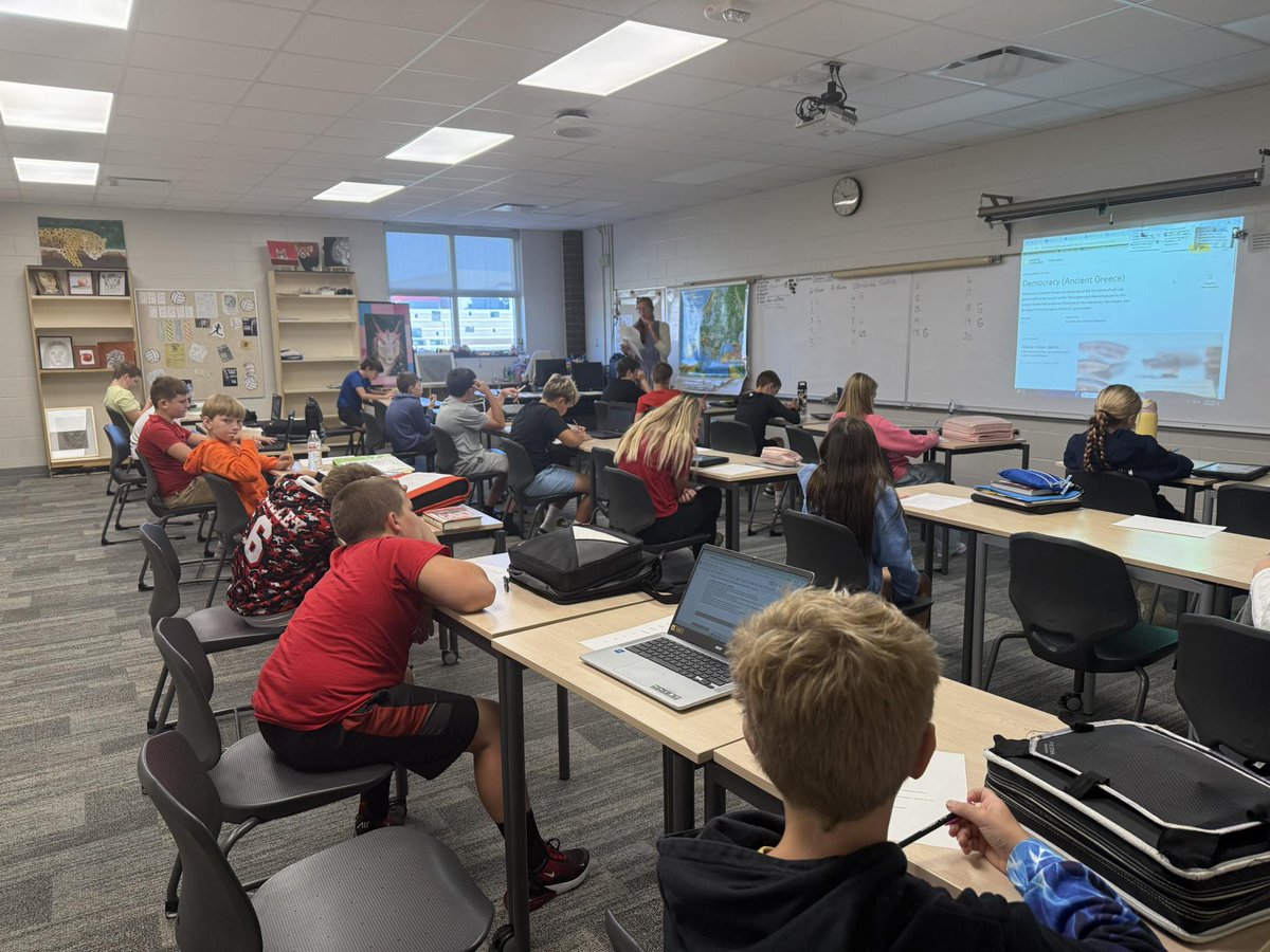 Mrs. Creek’s class discussing types of democracies throughout Ancient Greece and Rome and how this is similar to the US government today.