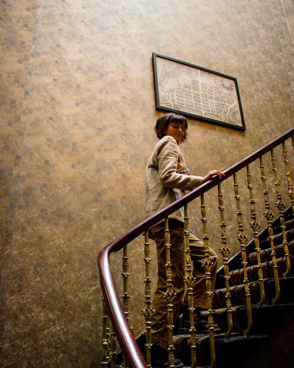 Winding through our Georgian townhouse, this staircase is more than just a passage, it's a piece of history. From the ornate carpeting to the warm brass banisters, every detail reflects the timeless charm of Nira Caledonia.