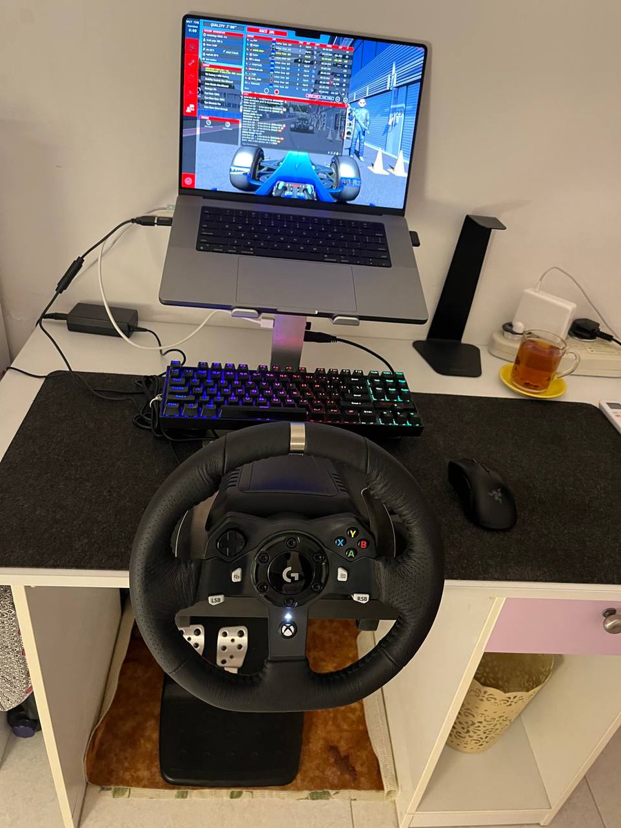 _rythomas's tweet image. Guy in my sim racing Discord is rocking the Apple Silicon MacBook Pro and a sttering wheel. Definition of locked in.
