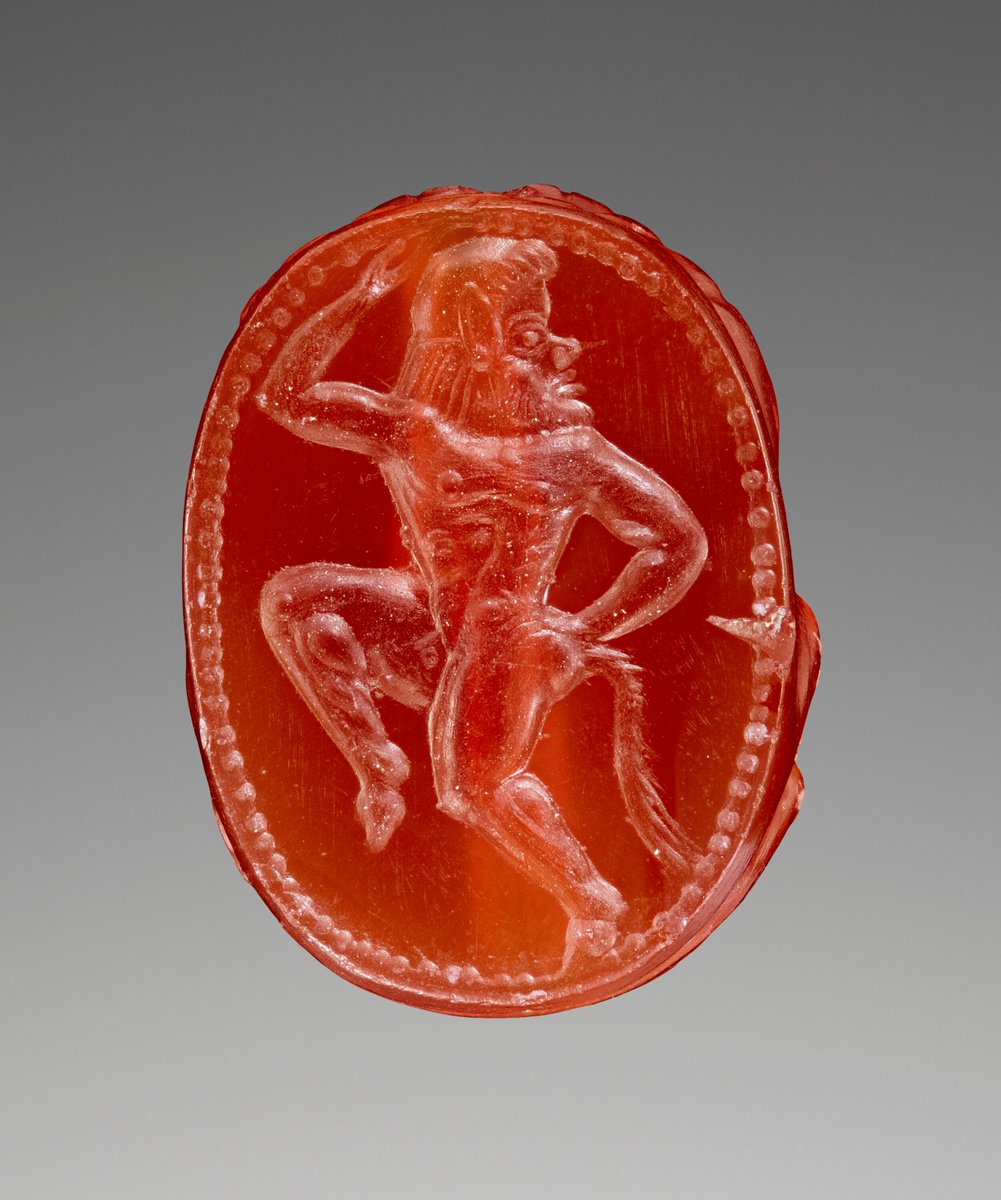Carnelian intaglio with dancing satyr, Etruscan, 500-475 BC from The J. Paul Getty Museum.