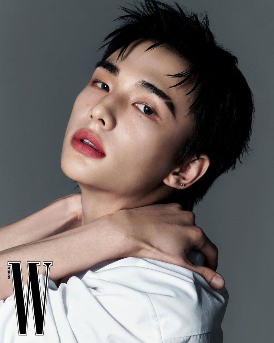 A portrait that feels like a quiet whisper, where vulnerability intertwines with strength. The tilt of his head, the softness in his lips, and the intensity in his gaze weave a story without a single word spoken.